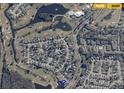 Community aerial view featuring golf course, lake, and nearby amenities at 2615 Autumn Green Dr, Orlando, FL 32822
