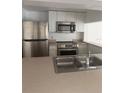 Functional kitchen featuring stainless steel appliances and ample counter space at 567 Caribbean Dr, Davenport, FL 33897