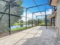 Enjoy this beautiful outdoor living space with screened patio overlooking the serene lake view at 567 Villa Park Rd, Kissimmee, FL 34759