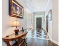 Elegant foyer featuring a striking tile pattern, ample natural light, and a welcoming ambiance at 715 Honeysuckle Ave, Celebration, FL 34747