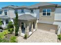 Charming two-story home with a covered front porch, two-car garage, and a beautifully paved driveway at 1817 Caribbean View Ter, Kissimmee, FL 34747
