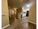 Bright kitchen seamlessly connects to the living room, creating an open and inviting space at 19935 Villa Isle Dr # 107, Orlando, FL 32821