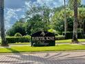 Community sign for Hawthorne Village with lush landscaping at 2408 Barley Club Ct # 2, Orlando, FL 32837