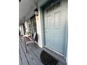 Inviting entrance with sliding glass doors, seating area, and a stylish front door at 4820 Conway Rd # 130, Orlando, FL 32812