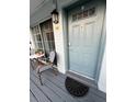 Inviting entrance with sliding glass doors, seating area, and a stylish front door at 4820 Conway Rd # 130, Orlando, FL 32812