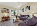 Comfortable living room featuring a ceiling fan and an abundance of natural light at 550 Castlemain Cir, Davenport, FL 33897