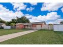 Inviting single-Gathering home with a well-manicured lawn and a private driveway at 1007 Maya Ave, Orlando, FL 32822