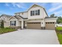 Exterior of a home with a 3-car garage, stone accents, and craftsman-style details at 1019 Cloud Ridge Ct, Mount Dora, FL 32757