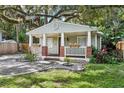 Charming home featuring a cozy front porch with brick accents, flower boxes and a landscaped front yard at 1104 E Anderson St, Orlando, FL 32801