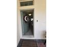 A welcoming front entryway with a decorative wreath on the door at 16043 Scarpetta St, Winter Garden, FL 34787