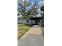 Charming single-story home with a covered front porch and mature landscaping at 2350 Valley Dr, Apopka, FL 32703