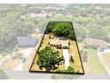 Overhead view of home with large, private backyard surrounded by mature trees at 2560 Greenwood Dr, Kissimmee, FL 34744