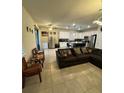 Open concept living area flows into modern kitchen with sleek stainless steel appliances at 748 Citrus Isle Dr, Davenport, FL 33837