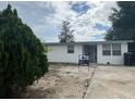Charming single-story home with a well-maintained front yard, for sale sign and driveway at 924 Ferndell Rd, Orlando, FL 32808