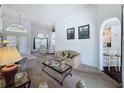 Inviting living room featuring neutral tones and an open floor plan with lots of natural light at 925 Montana Ave, Davenport, FL 33897