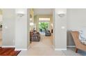 Open-concept living area with neutral tones, cozy seating, and lots of natural light at 2374 Eagle Trace Dr, Kissimmee, FL 34746