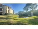 Beautiful view of a pond with fountain near a condo building at 3038 Parkway Blvd # 204, Kissimmee, FL 34747