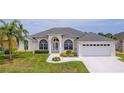 Charming single-story home with a well-manicured lawn and attached two-car garage at 3256 Countryside View Dr, St Cloud, FL 34772