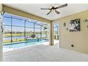 Screened lanai with pool overlooking lake at 433 Via Abruzzi St, Kissimmee, FL 34759