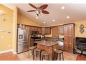 Kitchen featuring stainless steel appliances, granite countertops, and a center island at 5572 Myakka Ave, Intercession City, FL 33848
