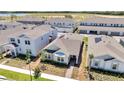 Aerial view showing this home's location in a well-planned community with neighboring houses and green spaces at 6494 Rover Way, St Cloud, FL 34771
