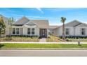Inviting single-story home with manicured lawn, quaint entryway, and neat exterior at 6494 Rover Way, St Cloud, FL 34771