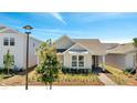 A charming single-story home showcases a well-kept lawn and classic architectural design at 6494 Rover Way, St Cloud, FL 34771