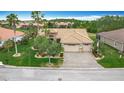 Beautiful home featuring a well-manicured lawn, tropical landscaping, and a paver driveway leading to a two-car garage at 772 San Raphael St, Kissimmee, FL 34759