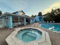 Resort-style pool and hot tub area with ample seating, perfect for relaxation and socializing at 2721 N Poinciana Blvd # 163, Kissimmee, FL 34746