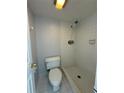 A full bathroom showing the shower and toilet with tiled walls at 200 Maitland Ave # 80, Altamonte Springs, FL 32701