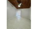 An empty bedroom featuring wood paneling on the ceiling and new vinyl floors at 200 Maitland Ave # 80, Altamonte Springs, FL 32701