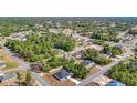 Scenic aerial view of a residential neighborhood, showcasing a mix of homes surrounded by lush greenery and trees at 2639 Sw 162Nd Street Rd, Ocala, FL 34473