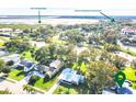 Aerial view of the property showing the surrounding landscape and nearby Lake Tohopekaliga at 302 E Drury Ave, Kissimmee, FL 34744