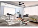 Open living and dining area with ample natural light and modern furnishings at 302 E Drury Ave, Kissimmee, FL 34744