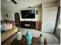 Inviting living room with tile flooring, a decorative fireplace and an open layout at 344 Winter Ridge Blvd # 344, Winter Haven, FL 33881