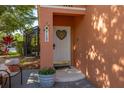 Charming front door adorned with sunflower decor and a 'Welcome' sign, enhanced by a potted plant at 4722 Flagler Beach Way, Kissimmee, FL 34746