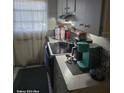 Functional kitchen featuring tiled backsplash, ample counter space, and natural light at 7511 Us Highway 98 N, Lakeland, FL 33809
