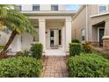 Charming front entrance with a brick pathway and manicured landscaping enhancing curb appeal at 11843 Fiction Ave, Orlando, FL 32832