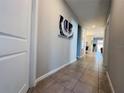 Spacious hallway with tile flooring and modern decor; great natural light at 1321 Yorkdale Rd, Davenport, FL 33837