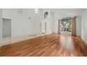 Spacious living room boasts wood floors and neutral wall colors at 1338 Lake Biscayne Way, Orlando, FL 32824