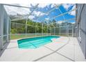 Screened in pool with blue water offers a refreshing outdoor space at 1338 Lake Biscayne Way, Orlando, FL 32824