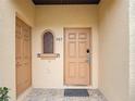 Exterior door with a stone welcome mat at 247 Verona Ave, Davenport, FL 33897