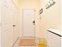 Clean, tiled hallway with closet and storage space, offering practical storage solutions at 2778 Almaton Loop # 403, Kissimmee, FL 34747
