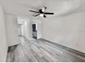 Well-lit bedroom featuring fresh paint, vinyl floors, and a ceiling fan at 2831 Magnolia Ave, Sanford, FL 32773