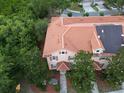 An aerial view of a townhouse featuring a terracotta-colored tile roof at 2901 Puerta Del Sol Blvd, Kissimmee, FL 34744