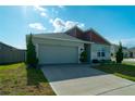 Charming single-Gathering home with a two-car garage, complemented by manicured landscaping and stone accents at 400 Chayne Pl, St Cloud, FL 34771