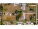 Expansive property showcasing a well-maintained home, surrounded by lush greenery and serene ponds at 4091 Lippman Rd, St Cloud, FL 34772