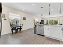 Spacious kitchen with stainless steel appliances, hardwood floors, an eat-in dining area, and lots of natural light at 4542 Cypress Cay Way, Kissimmee, FL 34746