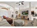 Inviting living room with vaulted ceiling, neutral color palette and modern furnishings at 131 Highland Meadows Pl, Davenport, FL 33837