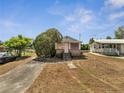 Charming single-story home with a mature tree in the yard at 1626 Salmon St, St Cloud, FL 34771